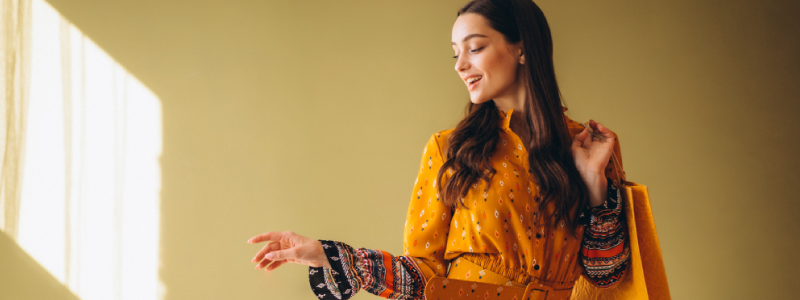 Happy fashion retail customer smiling after a positive shopping experience